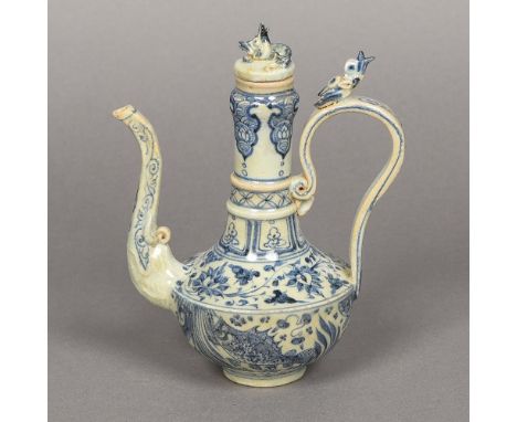 A Chinese blue and white porcelain ewerDecorated with an aquatic scene and lotus strapwork, the spout and handle moulded.  19