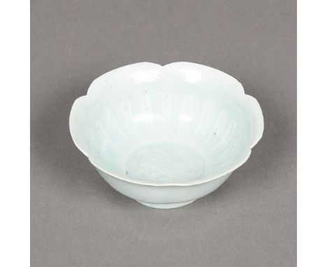 A Chinese porcelain lotus bowlThe interior worked with a mythical beast and with allover celadon glaze.  12.5 cm diameter.   