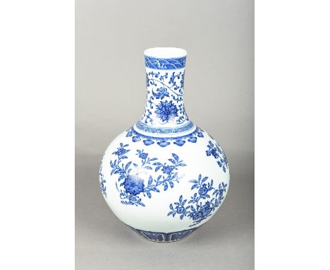 A Chinese blue and white porcelain vaseThe body decorated with fruiting and flowering sprays, the neck worked with lotus stra