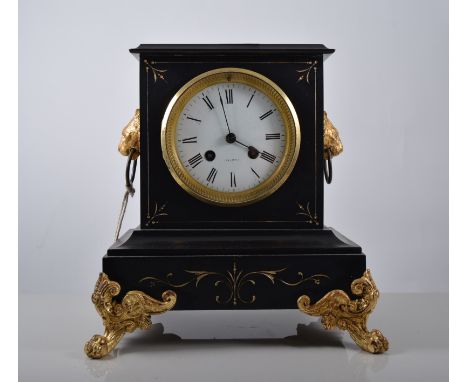 Black slate mantel clock with Roman numeral chapter ring, twin train bell strike movement, the case applied with gilt lion ma