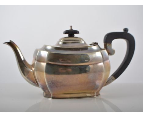 Silver three piece teaset, comprising teapot, ebonised handle and finial, height 15cm, milk jug and sugar bowl, B and F Limit