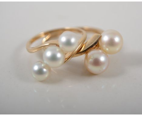 9ct gold cross over ring with two pearls, and another with three pearls, stamped 585, (2).