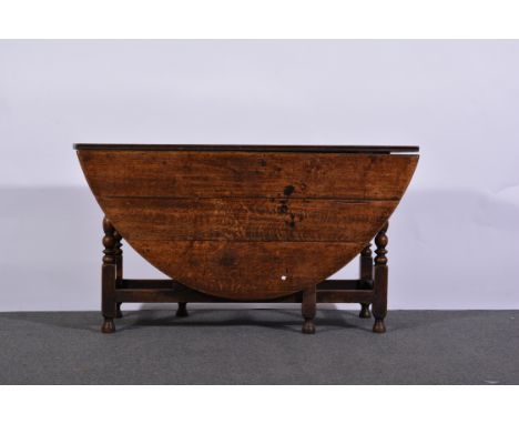 Joined oak table, oval top with two fall leaves, bobbin turned gate legs, 18th Century style, maximum 162 x 140cms.