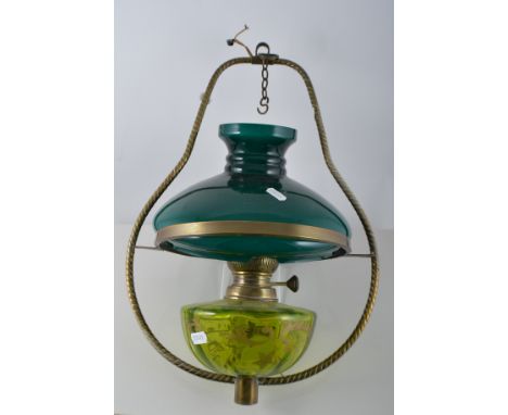 Victorian brass hanging oil lamp, cable twist frame, green tinted reservoir, complete with shade.