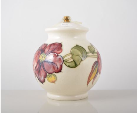 Moorcroft bulbous shaped lamp base, 'Anemone' design on an ivory coloured ground, 19cm with a shade.