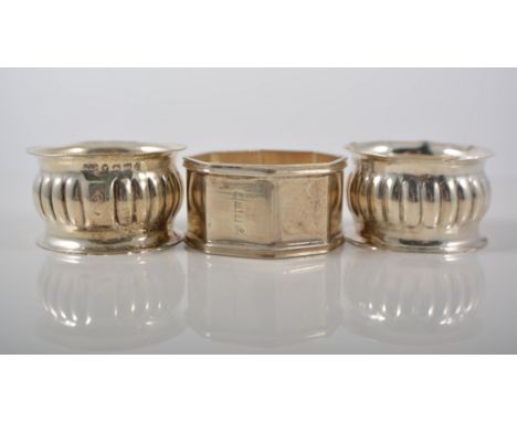 A cased silver horseshoe napkin ring, Sheffield 1960,  a pair of silver fluted barrel napkin rings and three others, (6).