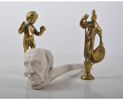 Three clay pipes and four others,  seven pipe tampers - brass,  a Marstons Burton Ales tobacco box, and a brass hand warmer.