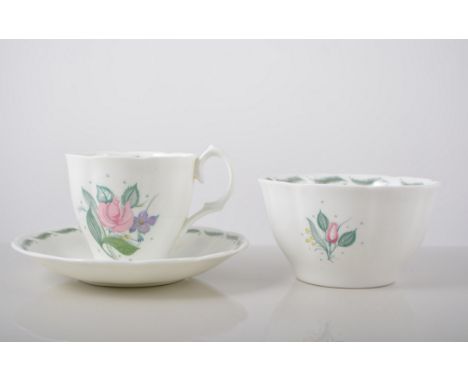 Susie Cooper part tea service, Fragrance pattern, signed in green comprising  1 cake plate, 12 tea plates, 11 saucers, 9 cups