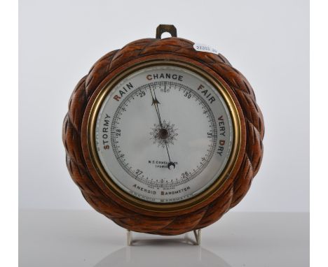 Tenco electric mantel clock, nautical style, height 14cms, width 17cms and oak cased aneroid barometer by W.H. Cowell Ltd., I