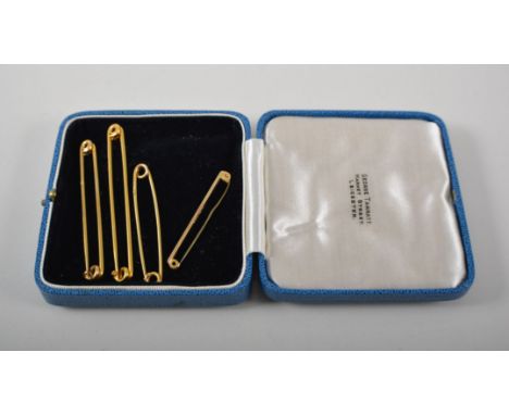 Yellow metal pin, marked 9ct, 7cm and four other pins and tie pins, smaller (5).