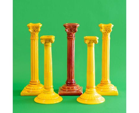 A Pair of Burmantofts Faience Pottery Corinthian Column Candlesticks, yellow mustard glaze, impressed B F ENGLAND 1198 L,29cm