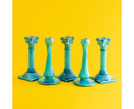 Three Burmantofts Faience Pottery Corinthian Column Candlesticks, turquoise glaze, one impressed B F ENGLAND 1198 L,21.5cm hi
