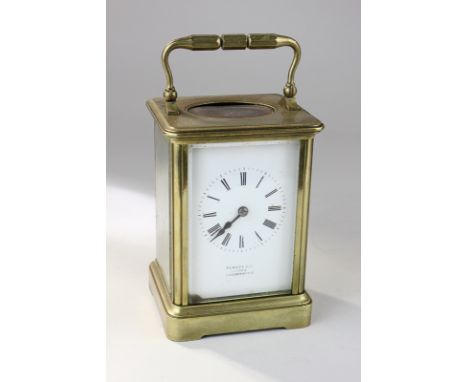 A brass and bevelled glass cased carriage clock, the white enamel dial marked Pearce & Co, Leeds & Huddersfield, with Roman n