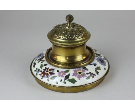 A brass and enamel inkwell with circular cover and floral decoration, 11cm