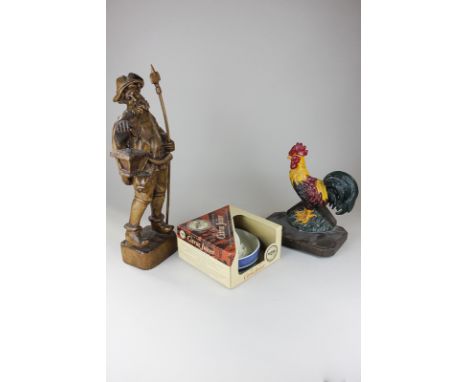 A carved wooden figure of a bearded watchman carrying lantern, 42cm, a cast iron doorstop, a painted metal cockerel on wooden