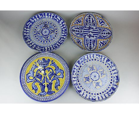 Four Delftware wall plates of similar size, various patterns, 30cm, (NC)