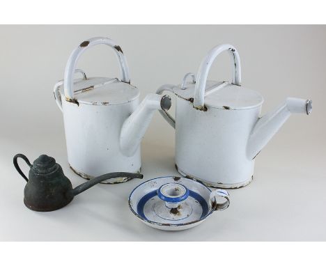 A pair of white enamel watering cans, 24cm, a chamber stick and a small copper watering can (NC)