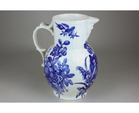 A 19th century Royal Worcester blue and white porcelain mask jug decorated with mixed flowers, scroll handle (hairline crack 