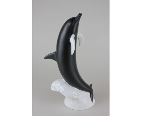 A Royal Dux Bohemia porcelain model of a dolphin in black matte and white gloss finish, 36cm high