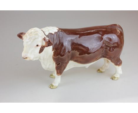 A Beswick Polled Hereford bull, model 2549A in brown and white gloss, with ringed nose