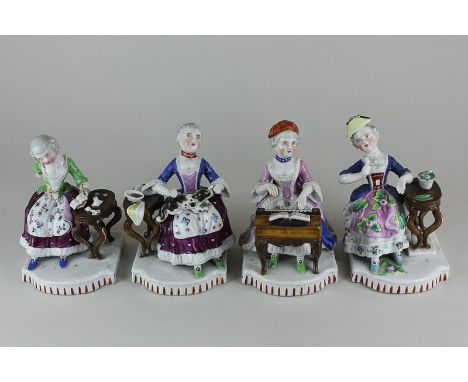 A set of four Continental porcelain figures of 18th century style women, all seated, gardening, playing the harpsichord, pett