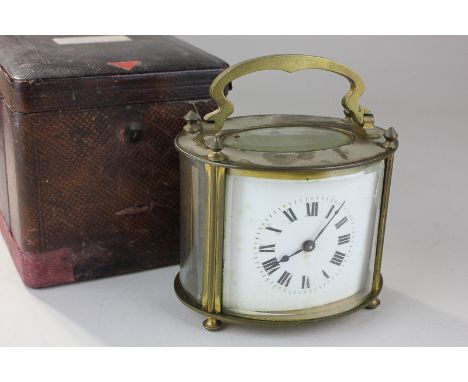 A glass and bevelled glass cased carriage clock, ovoid form, with Roman numerals on white enamel dial, in leather carry case 