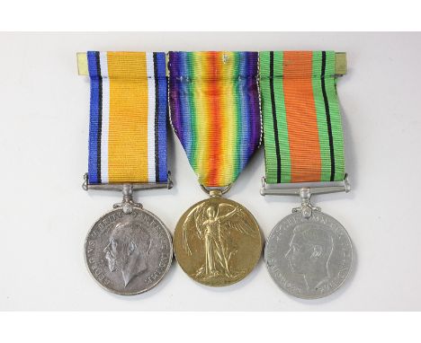A set of three First World War medals, The Defence, The War and The Victory, marked 19976 Pte F W Clifford G GDS