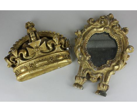 A giltwood and gesso small wall mirror with scroll surround, 32cm, and a gilt composition crown, 24cm, (NC)