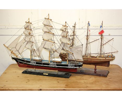 A model of the Cutty Sark in full sail, 83cm, together with a wooden model sailing ship titled Cote D'Emeraude, 74cm