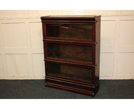 A Globe Wernicke style mahogany bookcase with three glazed tiers, on shaped base, 127.5cm