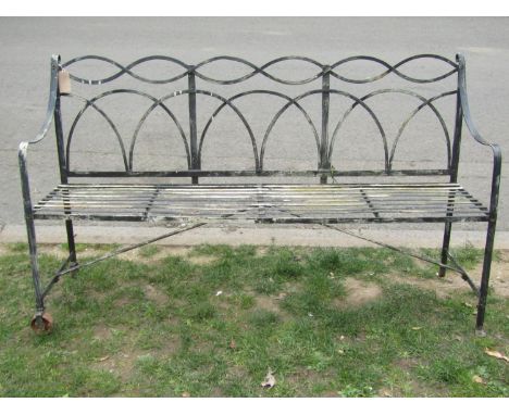 A painted and weathered Regency style portable two wheeled strapwork garden/games bench (af) 154cm 