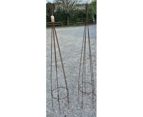 A pair of weathered light steel garden obelisks in the form of bound cane willow, 182cm high