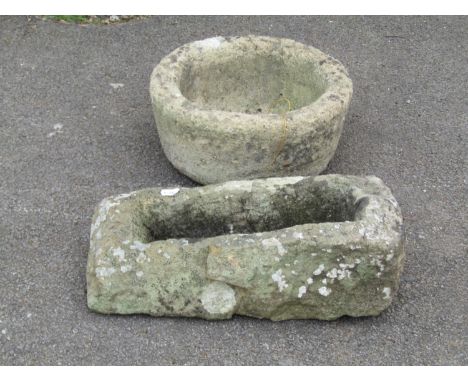 A small weathered natural rough hewn rectangular stone trough / planter, 14cm high, 40 x 16cm together with a weathered circu