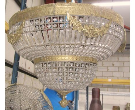 An impressive gilt-framed two-tier bag / pendant light, with floral garlands over two domed tiers fitted with clear cut hangi