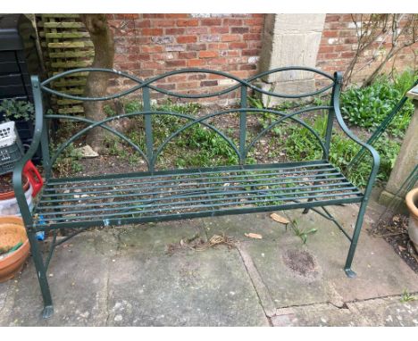 A Regency style strap work garden bench with decorative back detail and painted finish