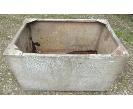 A vintage heavy gauge rectangular galvanized steel water trough with pop riveted seams, 50cm high x 90cm x 61cm