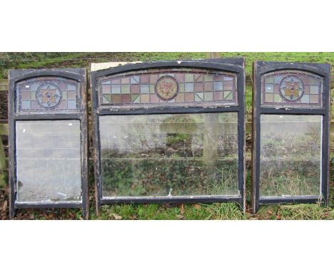 A reclaimed painted pine framed casement/sash window enclosing a rectangular glazed and arched stained and leaded light panel