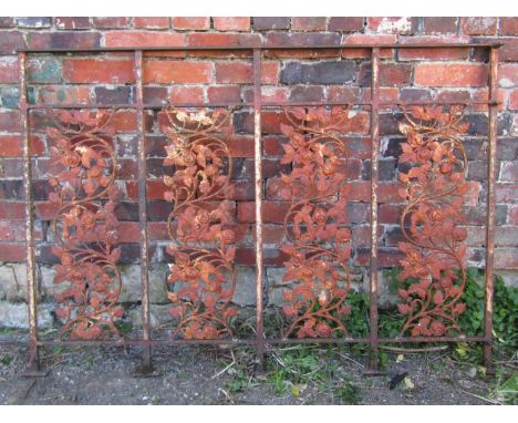 An old section of iron railing with repeating trailing scrolling rose pattern, approx 100cm high x 144cm