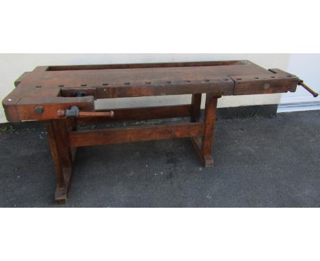 A good, large German-made workshop work bench, constructed from reclaimed timbers, with integral vices, with inset manufactur