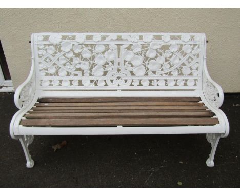 A Coalbrookdale painted cast iron garden bench, with intricate pierced floral and foliate back and ends in the Aesthetic Mann