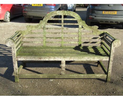 A Lutyens style weathered teak three seat garden  bench 166 cm long 