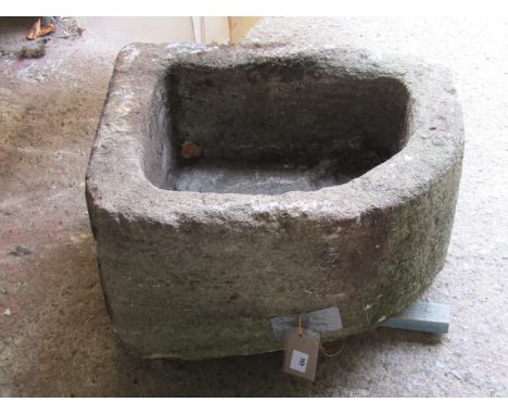 A weathered carved natural stone corner trough / planter, 28cm high, 51 x 44cm