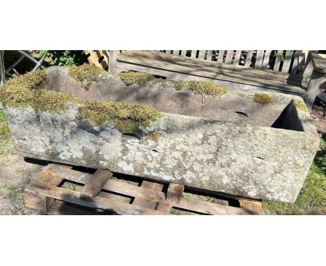 A large weathered natural stone planter / trough of deep rectangular form, 40cm high, 156 x 54cm (AF)