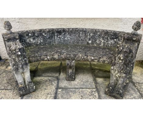 A weathered garden bench seat - mid 20th century probably produced in the Veneto area, curved in outline with low back and pi