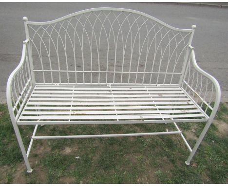 A cream painted contemporary Regency style light steel garden bench with strapwork seat and lattice back, 115cm wide