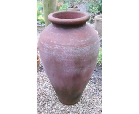 A terracotta oviform floorstanding jar, 70 cm high