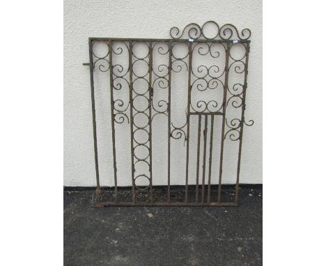 An old weathered ironwork garden gate with scrolling detail, 104cm high, 96cm wide