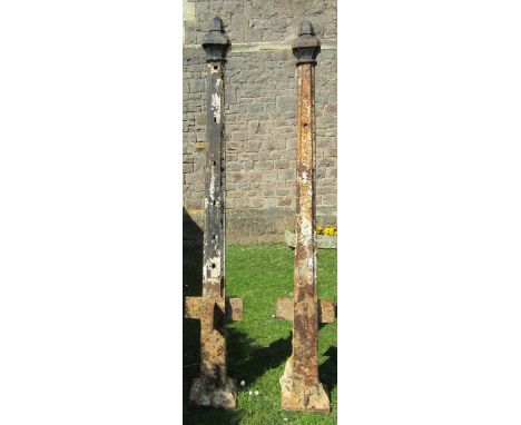 A pair of 19th century cast iron gate posts of square tapered form with shaped caps, stamped T Walker Engineer, Tewskesbury, 