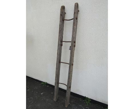 A rustic antique teak brewery four rung barrel  ladder, with simple threaded ironwork bolt steps, stencilled to side ‘Young’s