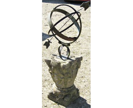 A weathered armillary sphere sundial with ironwork globe over a cast composition stone base, 125cm high